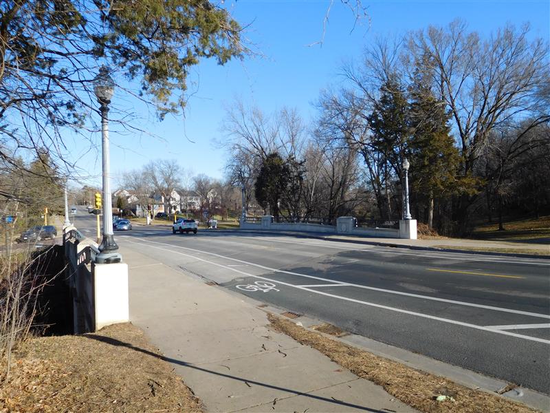 View of road and sidewalks going over a bridge