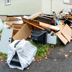 Trash in yard of house