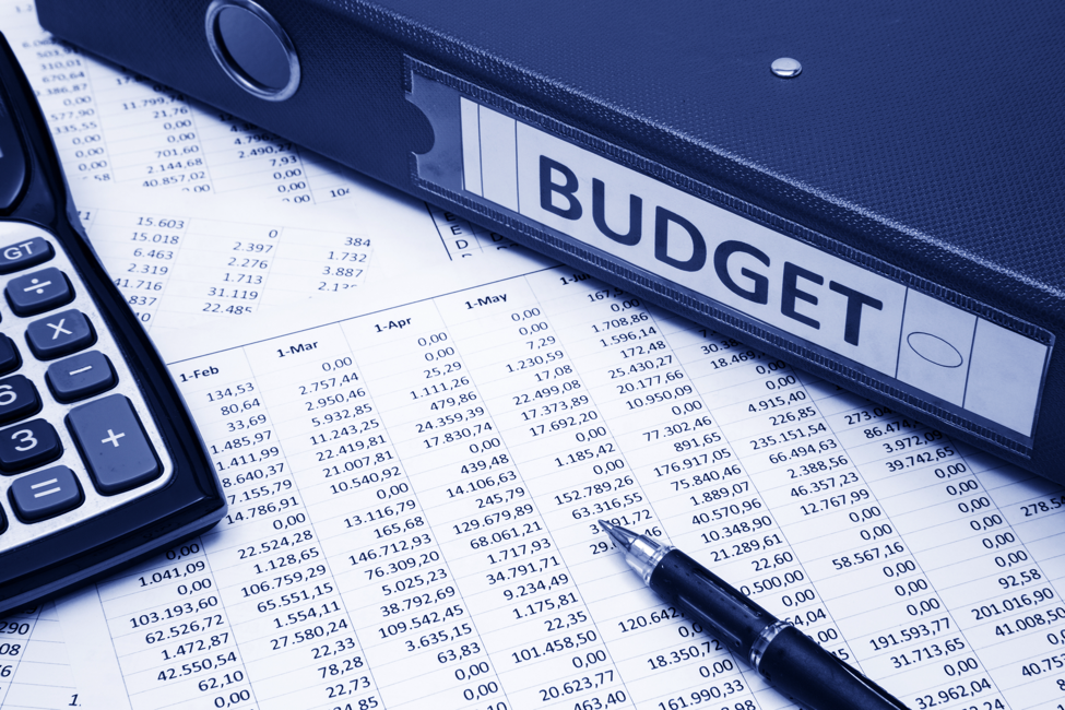 Budget binder, calculator, document and pen