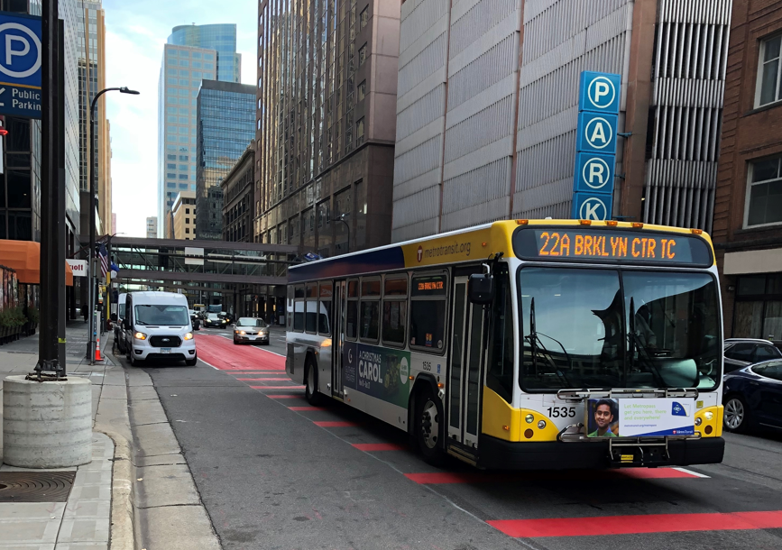 A bus driving through downtown Minneapolis.