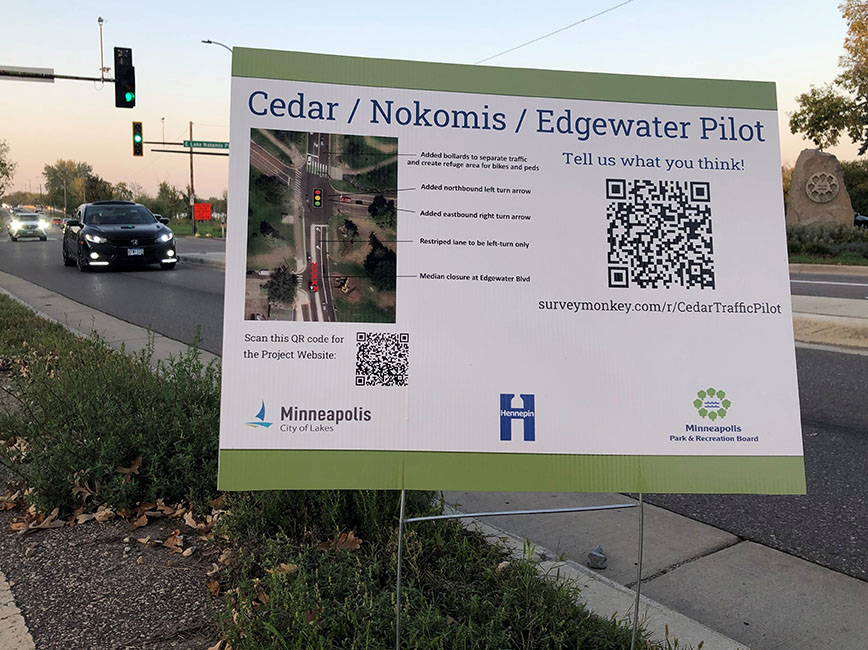 A yard sign with information about the Cedar-Nokomis-Edgewater pilot project.