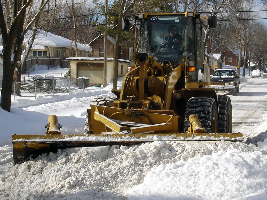 Snow plow on residential street Snow plow on residential street