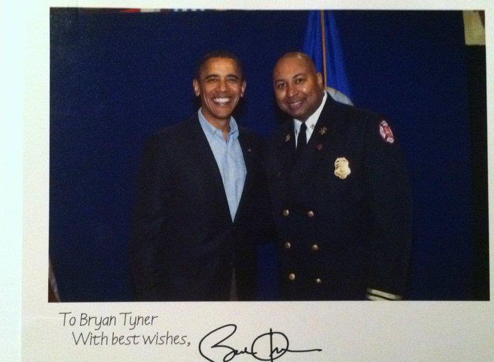 Former President of the United States Barack Obama and Fire Chief Bryan Tyner