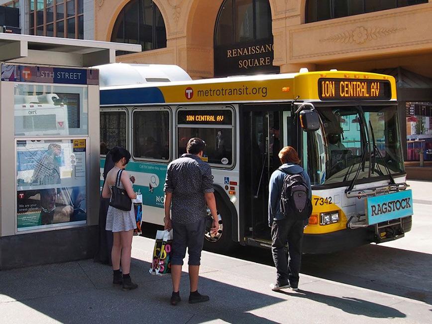 People boarding a Metro Transit bus on Nicollet Ave