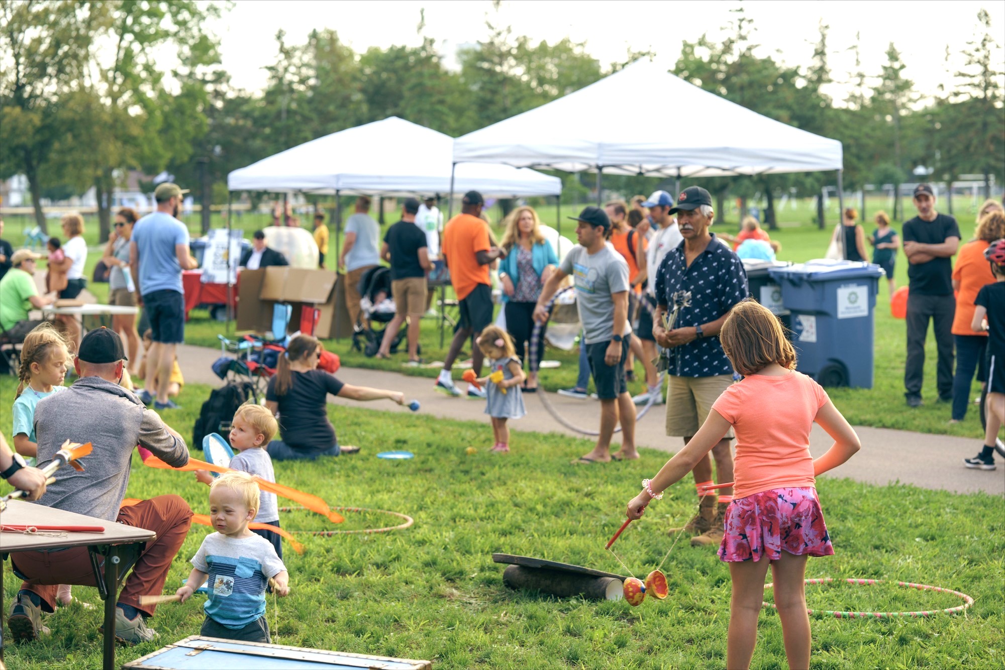 Children and adults playing during event outside in a park