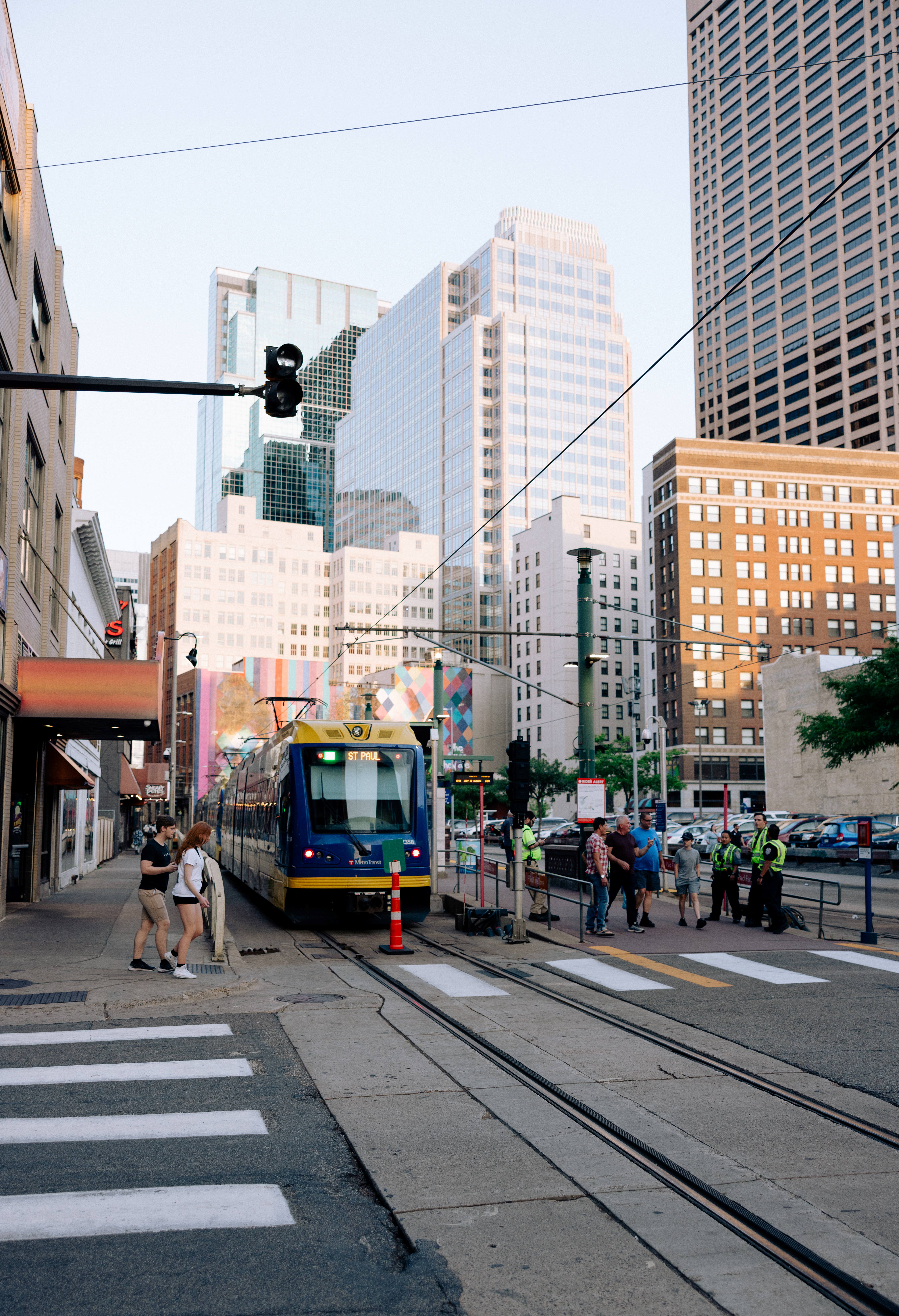 People at light rail station next to 1st Avenue N People at light rail station next to 1st Avenue N