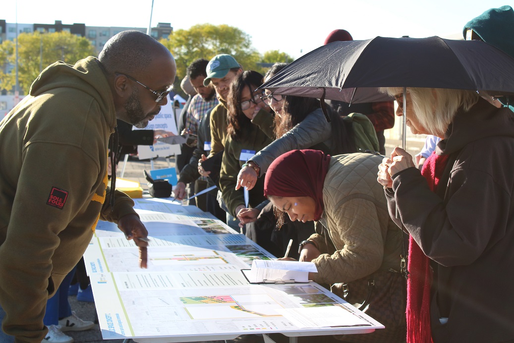 People gathering around a display outside