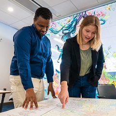 two people looking at map