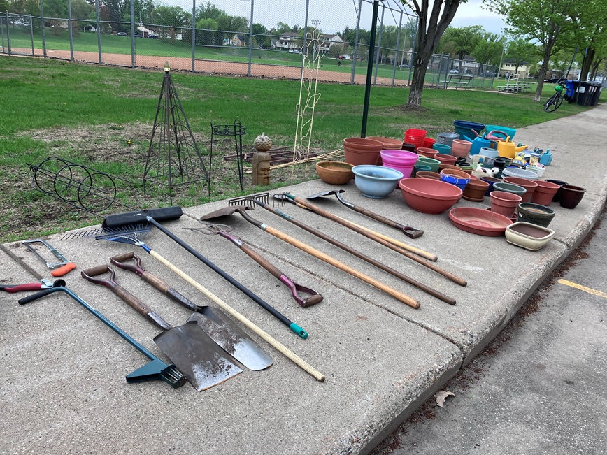 hand tools, shovels, flower pots, lawn decor at a garden tool swap