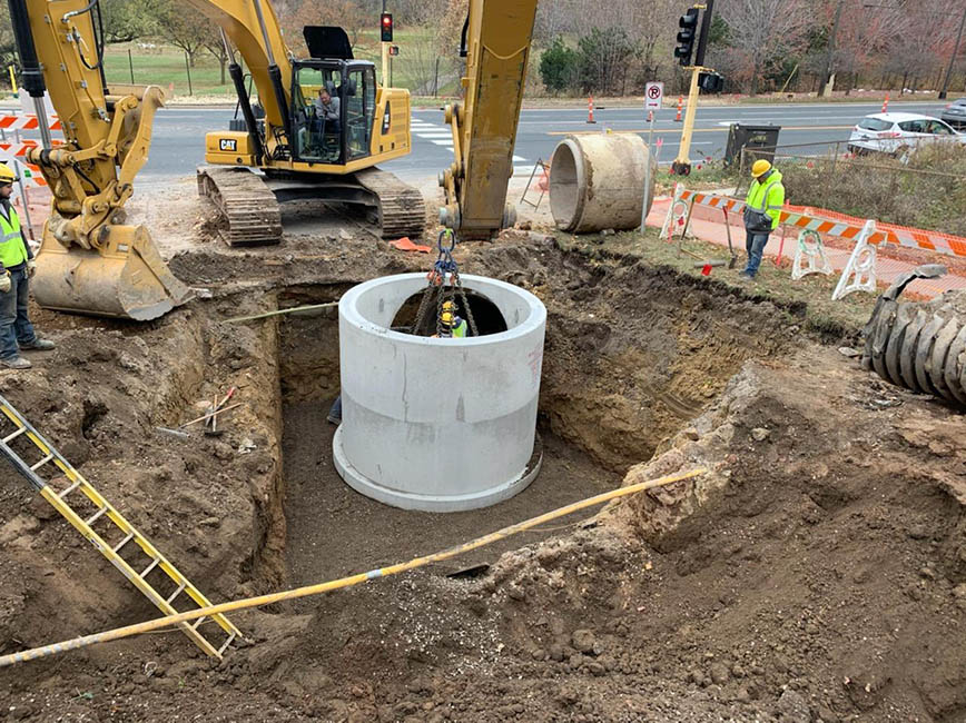 Sewer manhole being installed