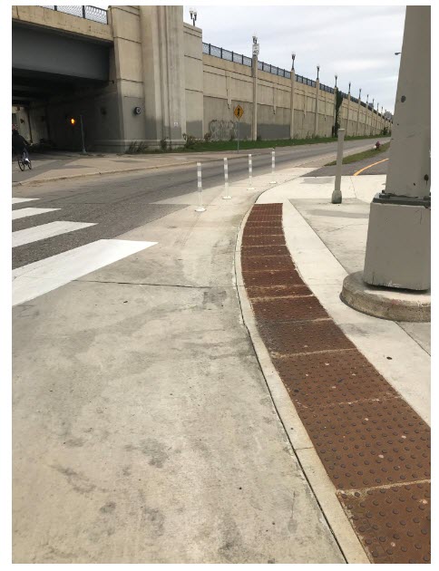 Slow turn wedge - wedges create a buffer between pedestrians and traffic. They also help vehicles follow the proper turning path.