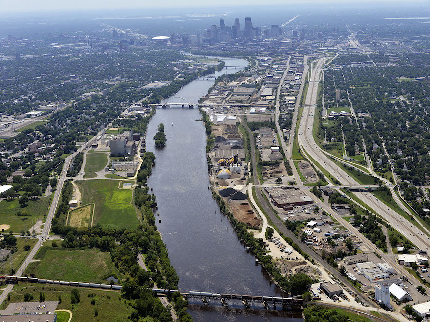 Aerial view of the Mississippi River with Minneapolis skyline.