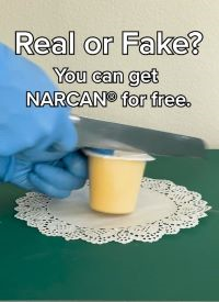 Gloved hands cutting into a pudding cup with a knife. Text at the top of the image says 