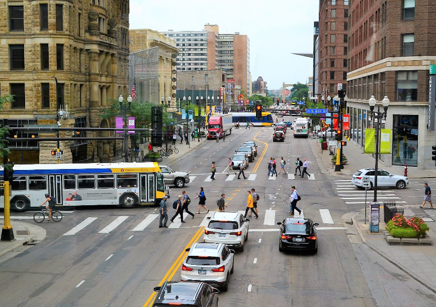 View of Minneaplis Downtown streets with pedestrians, cars and transit