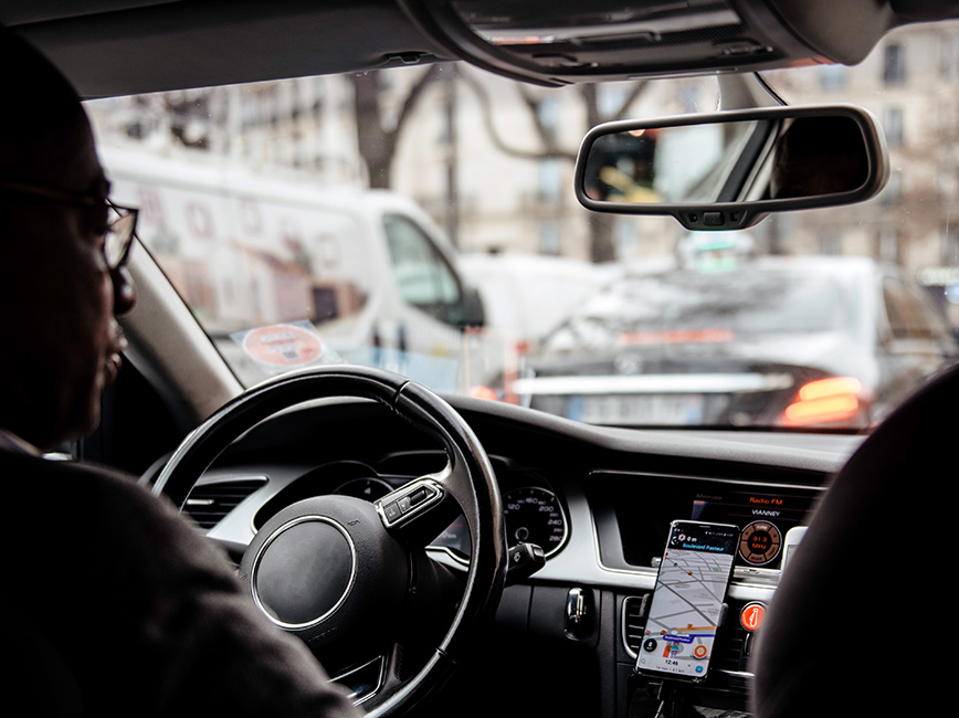 A man driving for a transportation network company (TNC)