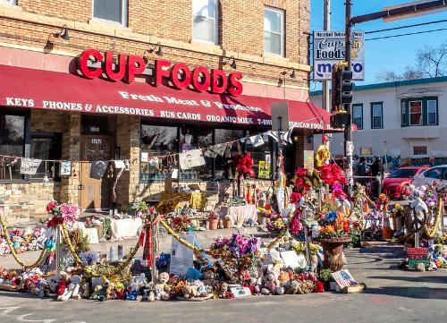 flowers in front of Cup Foods