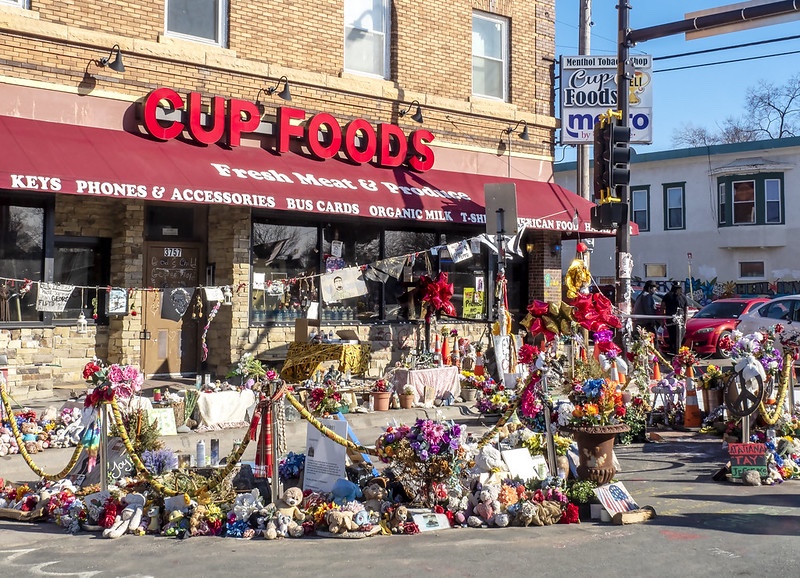 flowers in front of Cup Foods