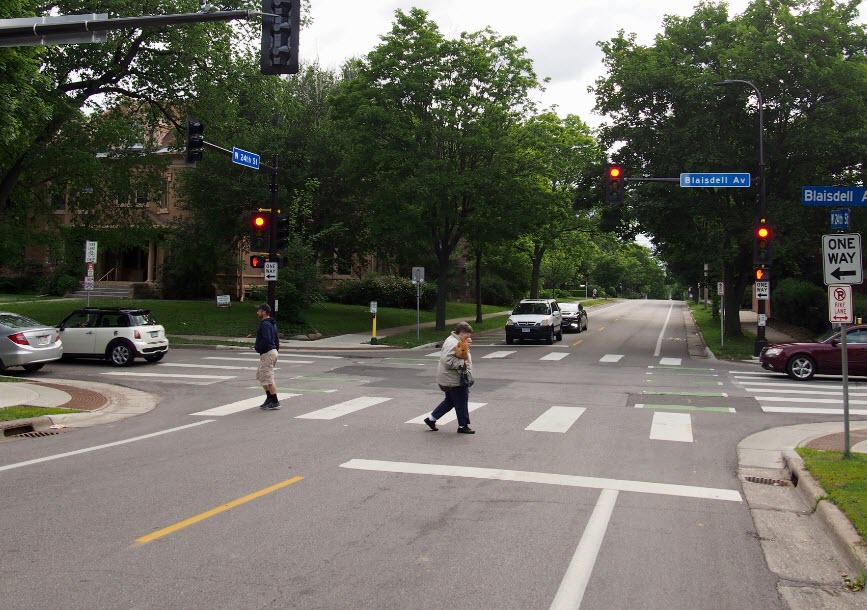 Hi-visibility crosswalk - " zebra markings" are more visible to approaching vehicles. They improve yielding behavior. 
