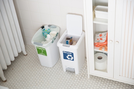 Organics and recycling bins in a bathroom
