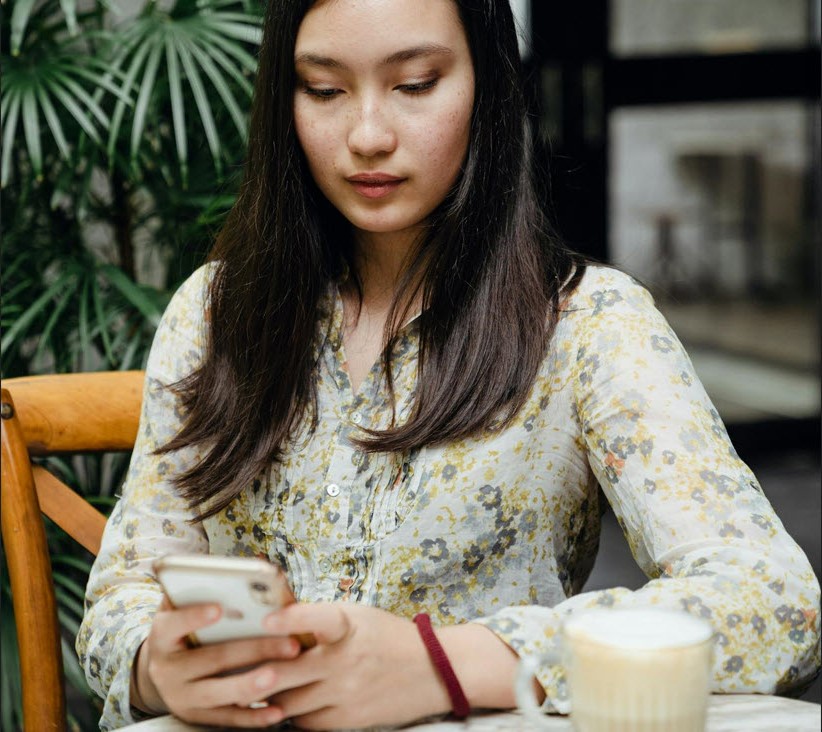 Person on phone texting