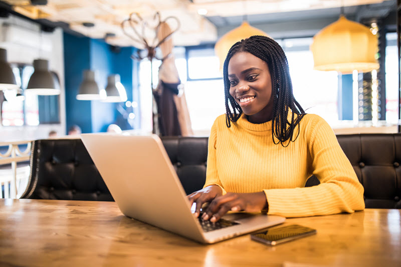 Smiling person at laptop