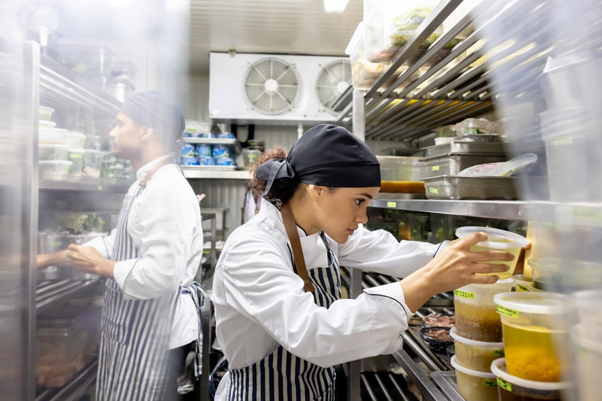 Cook working in a restaurant looking for ingredients