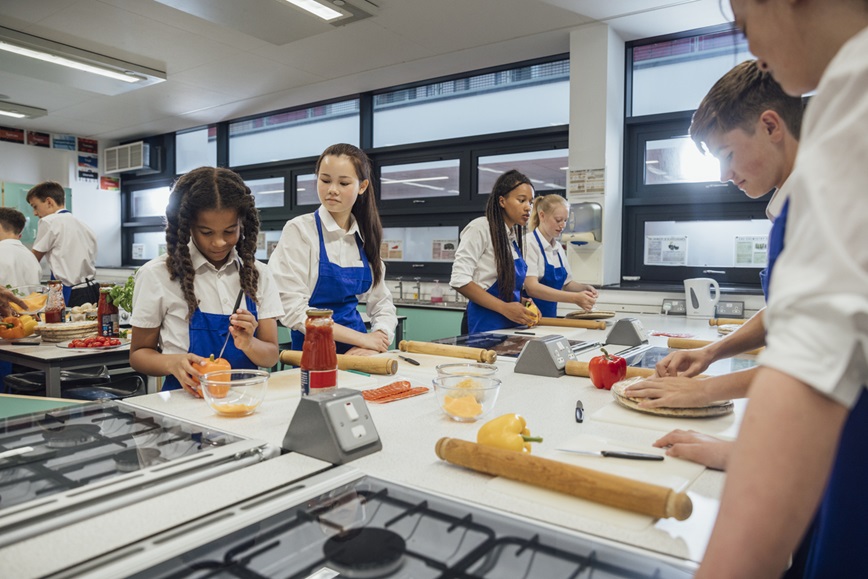 Teenage students in cooking class