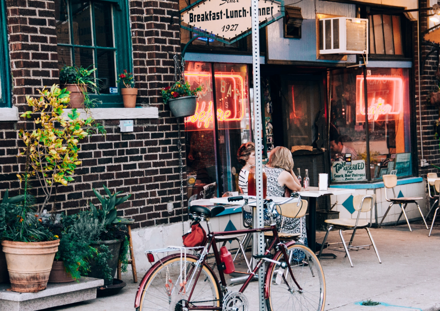 Bikes parked against a sign post unsplash Bikes parked against a sign post unsplash