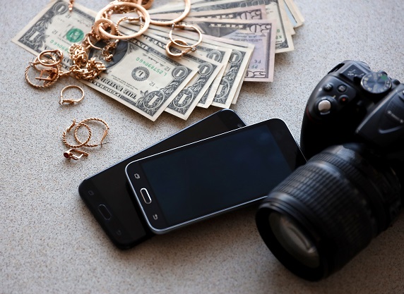 Pawnshop items cash, gold jewelry and camera