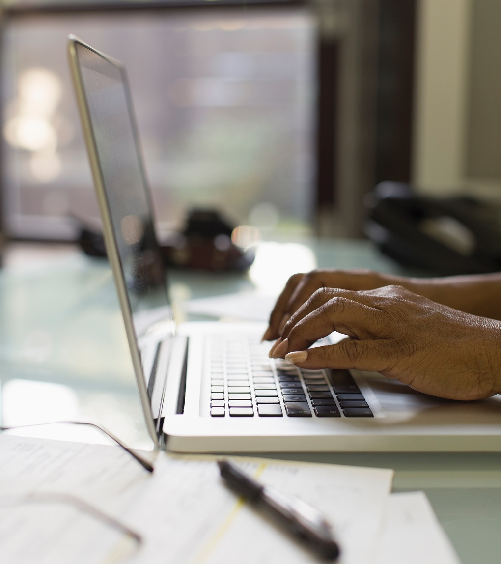 Two people using a computer