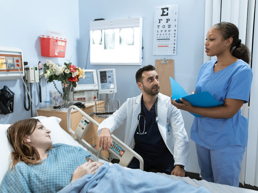 Nurses and doctors in a hospital room