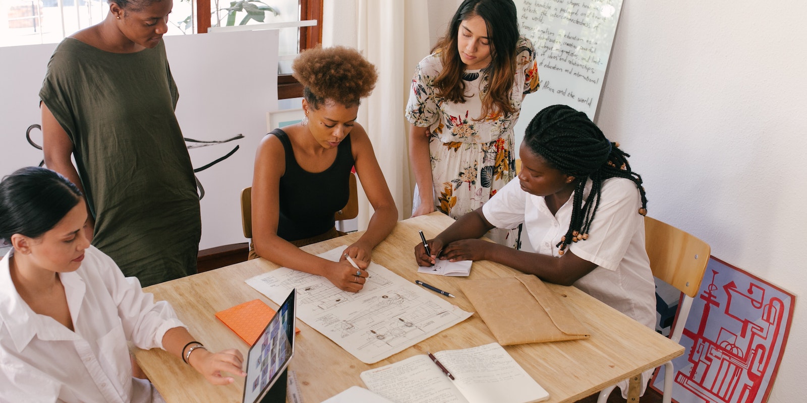 People meeting and working around a table
