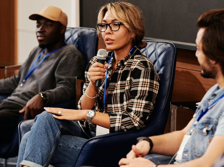 person with microphone at meeting