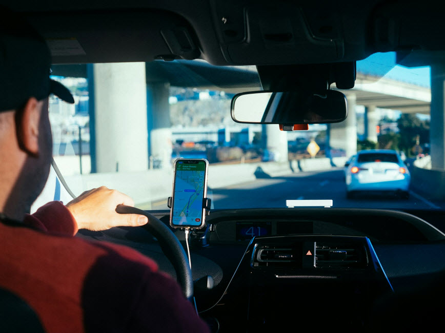 A person driving a car for a rideshare company
