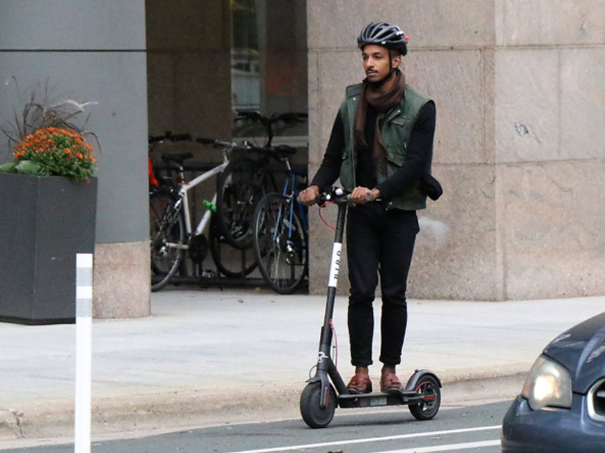 Riding scooter on street