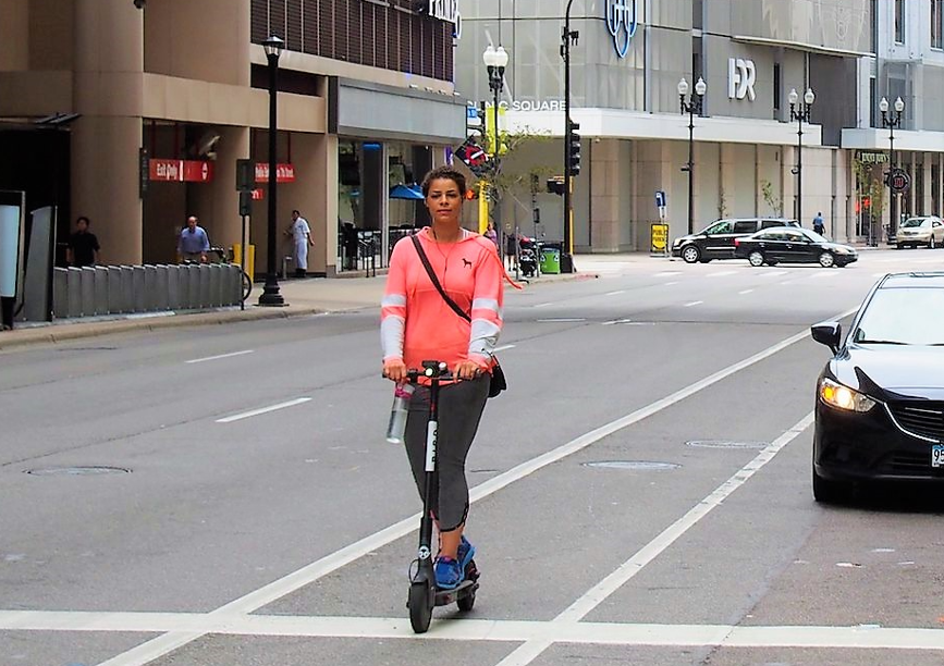 Person on scooter downtown mpls Person on scooter downtown mpls