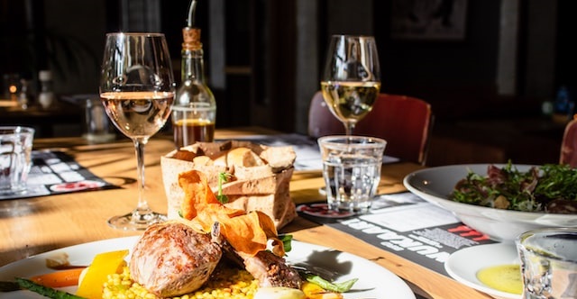 Restaurant setting with food and wine